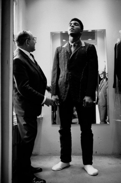 Muhammad Ali is fitted for a new suit