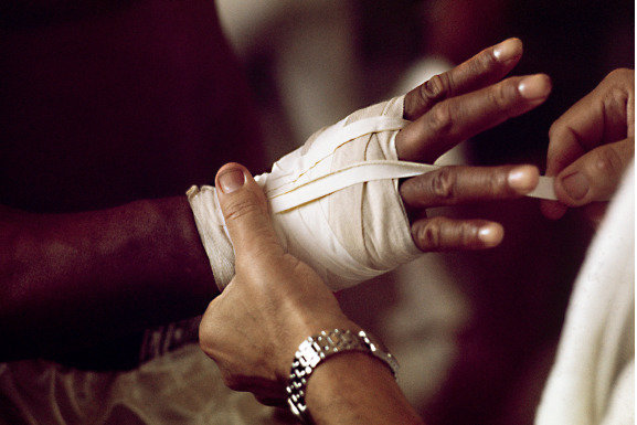 Muhammad Ali getting his hand strapped up